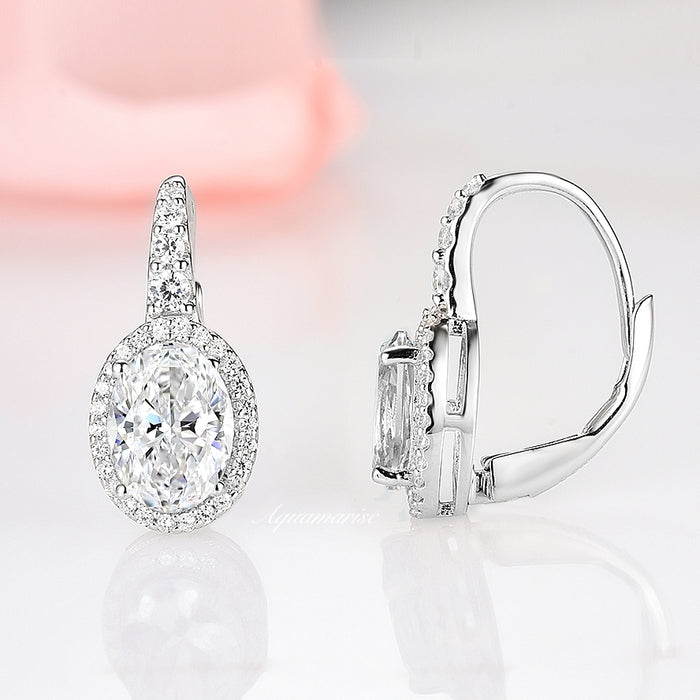 Simulated Diamond Dangle Earrings in Sterling Silver by Aquamarise, featuring oval-cut cubic zirconia surrounded by small stones on polished silver drop settings with secure lever-back clasps.
