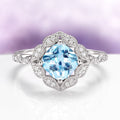Cushion Cut Vintage Aquamarine Ring in Sterling Silver featuring a vibrant cushion-cut aquamarine center framed by a vintage-inspired halo of sparkling accents on a detailed sterling silver band, by Aquamarise from Sterling Silver Rings and March Birthstone Jewelry collections.