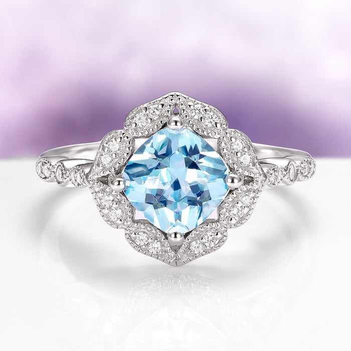Cushion Cut Vintage Aquamarine Ring in Sterling Silver featuring a vibrant cushion-cut aquamarine center framed by a vintage-inspired halo of sparkling accents on a detailed sterling silver band, by Aquamarise from Sterling Silver Rings and March Birthstone Jewelry collections.