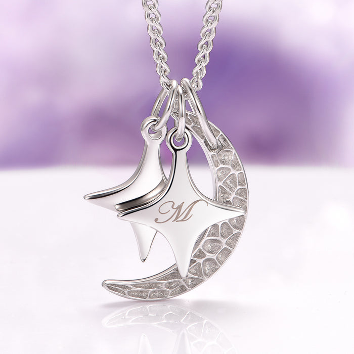 Custom Initial Necklace with Moon and Stars in Sterling Silver by Aquamarise, featuring a personalized initial charm, crescent moon, and star pendants on a durable silver chain.
