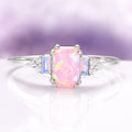 Dainty Pink Fire Opal Ring in Sterling Silver by Aquamarise, featuring a rectangular pink fire opal center with shimmering opalescent sapphires and delicate diamond accents on a slender sterling silver band, part of Sterling Silver Rings and October Birthstone collections.