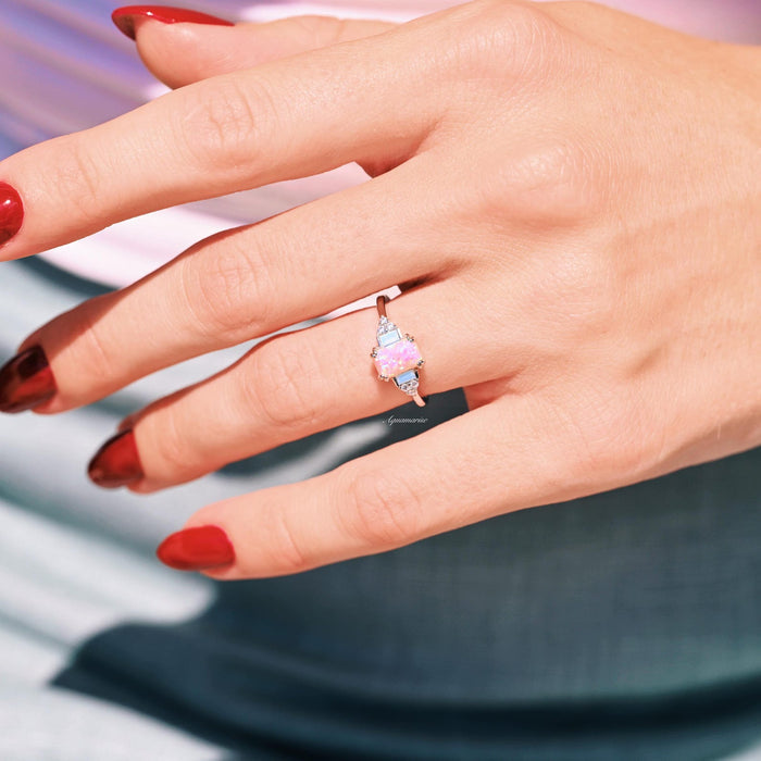 Dainty Pink Fire Opal Ring in Sterling Silver by Aquamarise, featuring a rectangular pink fire opal with sparkling opalescent sapphire accents on a minimalist sterling silver band, part of Sterling Silver Rings and October Birthstone collections.