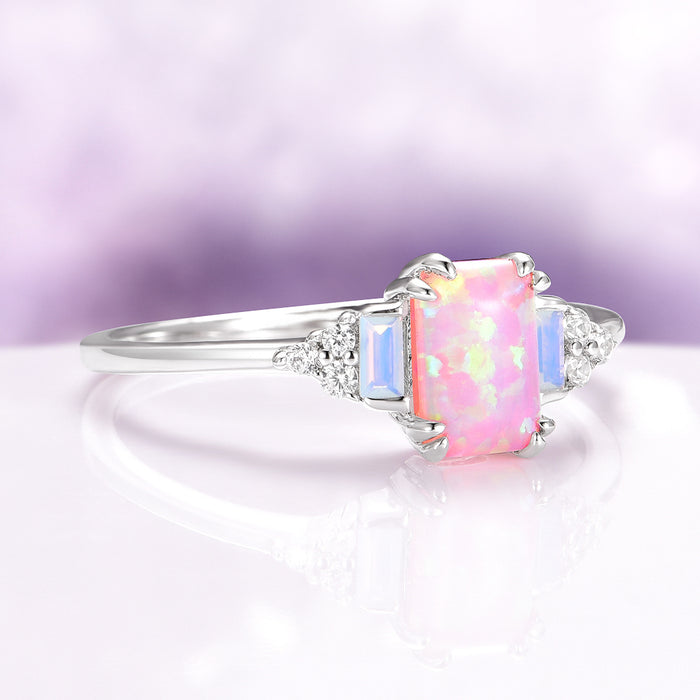 Dainty Pink Fire Opal Ring in Sterling Silver by Aquamarise, featuring an opalescent rectangular pink fire opal accented with delicate sapphire and diamond details on a slender 925 sterling silver band, part of Sterling Silver Rings, October Birthstone, and Unique Engagement Rings collections.