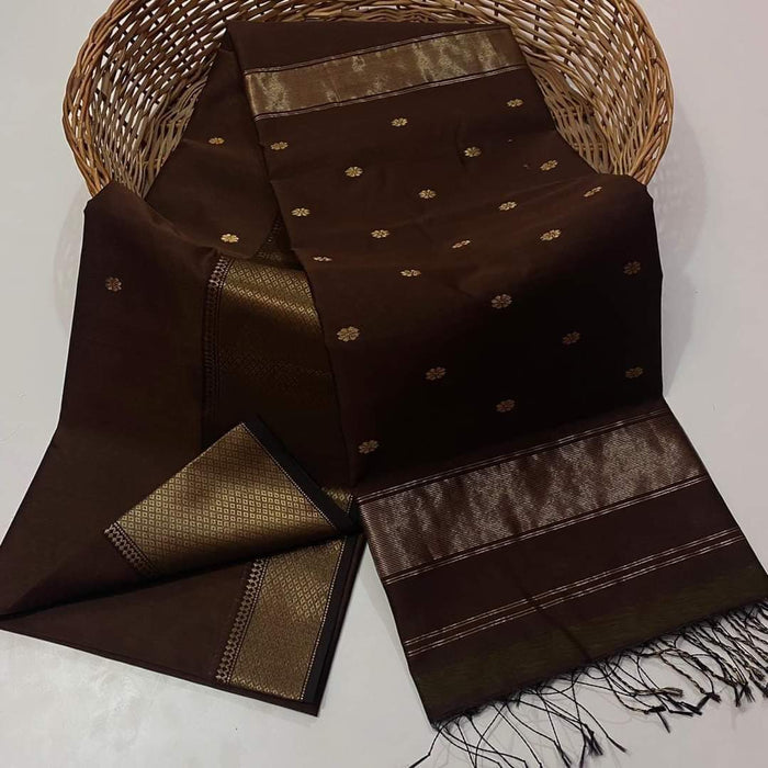 Dark brown Maheshwari silk saree with small gold buti and a prominent wide gold geometric border, handwoven in Maheshwar