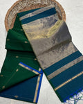 Dark green Maheshwari silk saree with small dobby-set buti and a deep teal pallu banded in metallic stripes, handwoven in Maheshwar