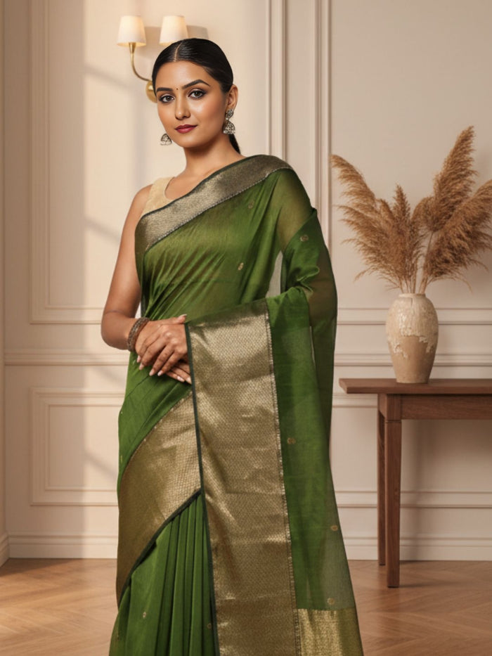 Handloom Maheshwari silk saree in dark olive green, flower buti scattered across the body, with a wide golden zari border