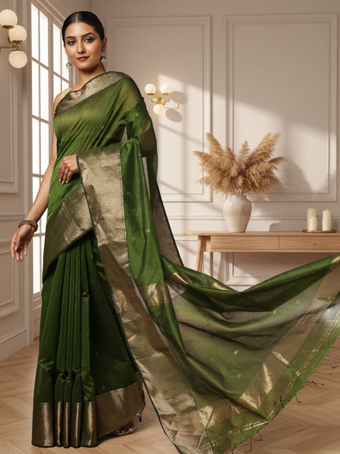 Handloom Maheshwari silk saree in dark olive green, flower buti scattered across the body, with a wide golden zari border