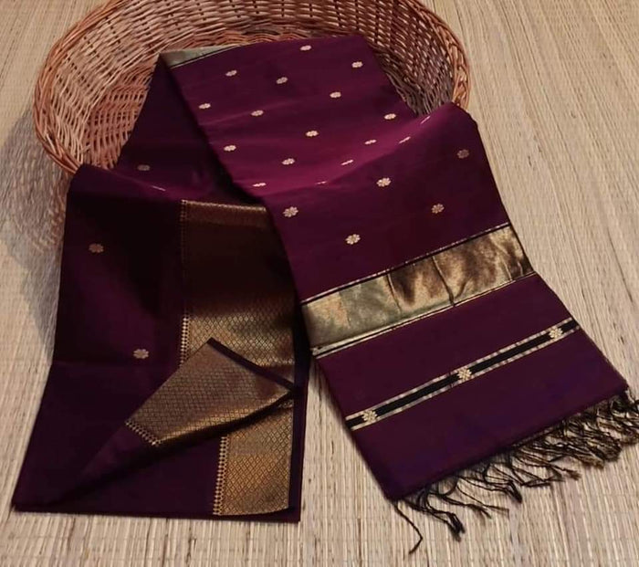 Dark violet Maheshwari silk saree with a butta body of small gold buti and wide gold and black borders, handwoven in Maheshwar