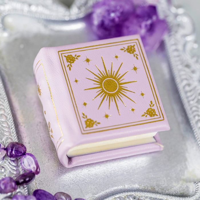 Dawn Court Leather Book Ring Box - Rose Glow Edition (Small) by Aquamarise, a vegan leather pink book-style ring box with gold celestial designs, perfect for meaningful jewelry gifts.