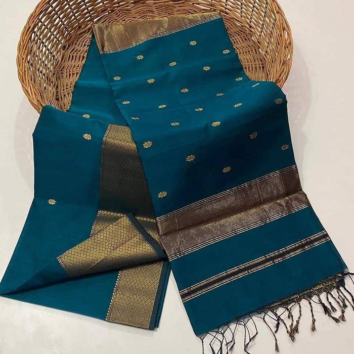Handloom Maheshwari silk saree in deep blue, flower buti scattered across the body, with a wide golden zari border