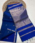 Deep blue Maheshwari silk saree with small gold dobby-set buti and a wide banded gold pallu, handwoven in Maheshwar
