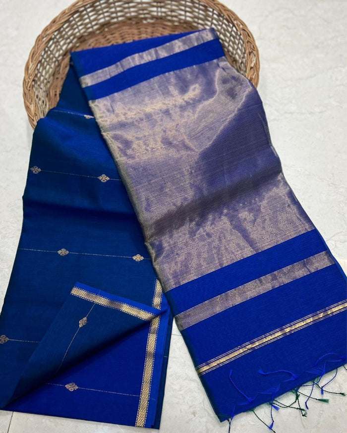 Deep blue Maheshwari silk saree with small gold dobby-set buti and a wide banded gold pallu, handwoven in Maheshwar
