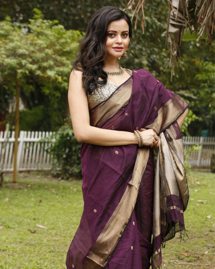 Handloom Maheshwari silk saree, deep purple body with flower buti, beige pallu with lotus buti and a golden zari border