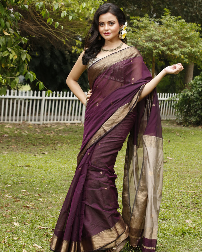Handloom Maheshwari silk saree, deep purple body with flower buti, beige pallu with lotus buti and a golden zari border