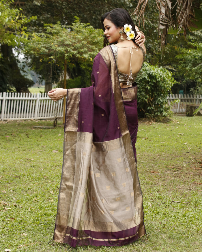 Handloom Maheshwari silk saree, deep purple body with flower buti, beige pallu with lotus buti and a golden zari border