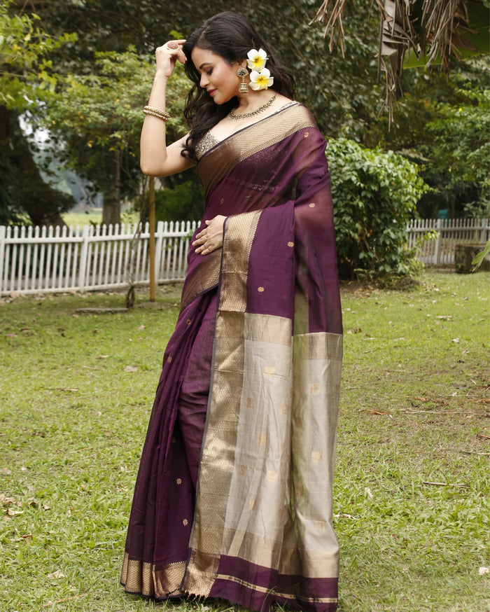 Handloom Maheshwari silk saree, deep purple body with flower buti, beige pallu with lotus buti and a golden zari border