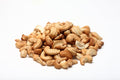 A pile of dry roasted cashew nuts without salt on a white background photo from Nutworks.