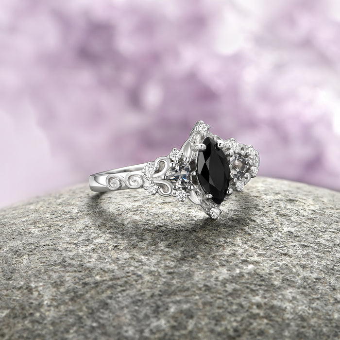 Elain Black Onyx Dark Fairy Leaf Ring in Sterling Silver featuring a marquise black onyx center stone with intricate leaf and swirl detailing on the band by Aquamarise.