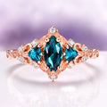 Elain Teal Sapphire Fairy Engagement Ring in 14K Rose Gold Vermeil featuring a marquise teal sapphire center with diamond accents in a nature-inspired rose gold setting by Aquamarise.