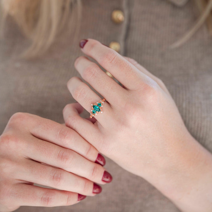 Elain Teal Sapphire Fairy Engagement Ring in 14K Rose Gold Vermeil worn on hand, featuring a nature-inspired teal sapphire center by Aquamarise.