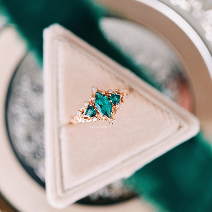 Elain Teal Sapphire Fairy Engagement Ring in 14K Rose Gold Vermeil by Aquamarise, featuring a marquise teal sapphire and leaf-inspired design in a rose gold setting.