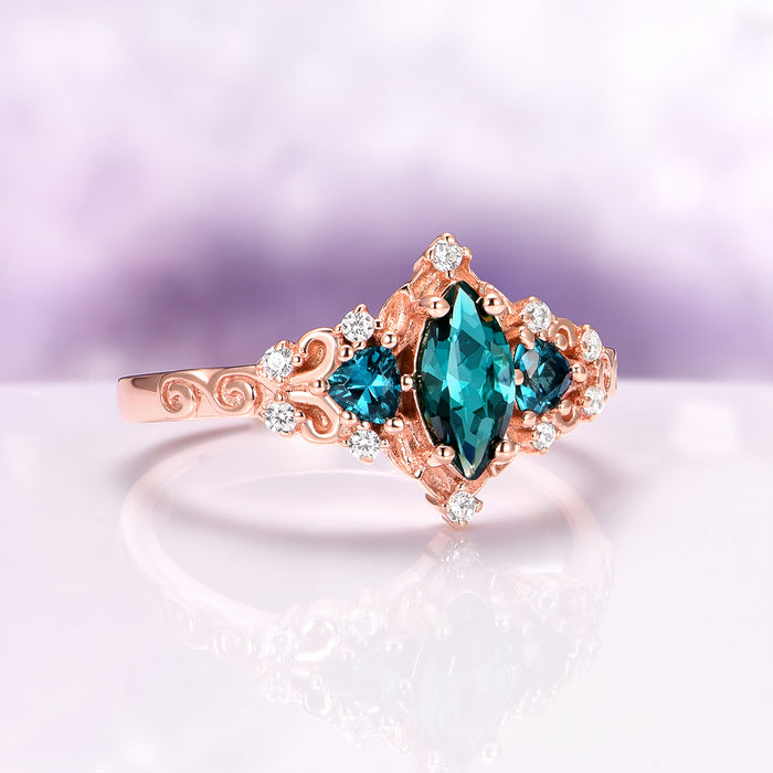 Elain Teal Sapphire Fairy Engagement Ring in 14K Rose Gold Vermeil with marquise teal sapphire center and diamond accents by Aquamarise, elegant nature-inspired design.