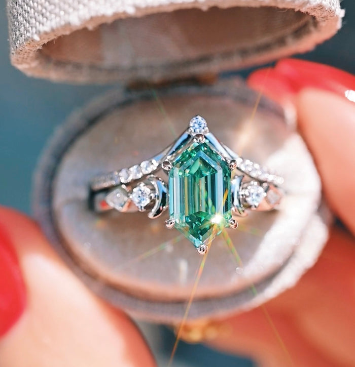 Elara Pacific Green Moissanite & Crescent Moon Engagement Ring Set in 14K White Gold by Aquamarise Gold features a hexagonal green moissanite center stone with crescent moon and diamond accents, a unique non-traditional engagement ring perfect for statement jewelry lovers.