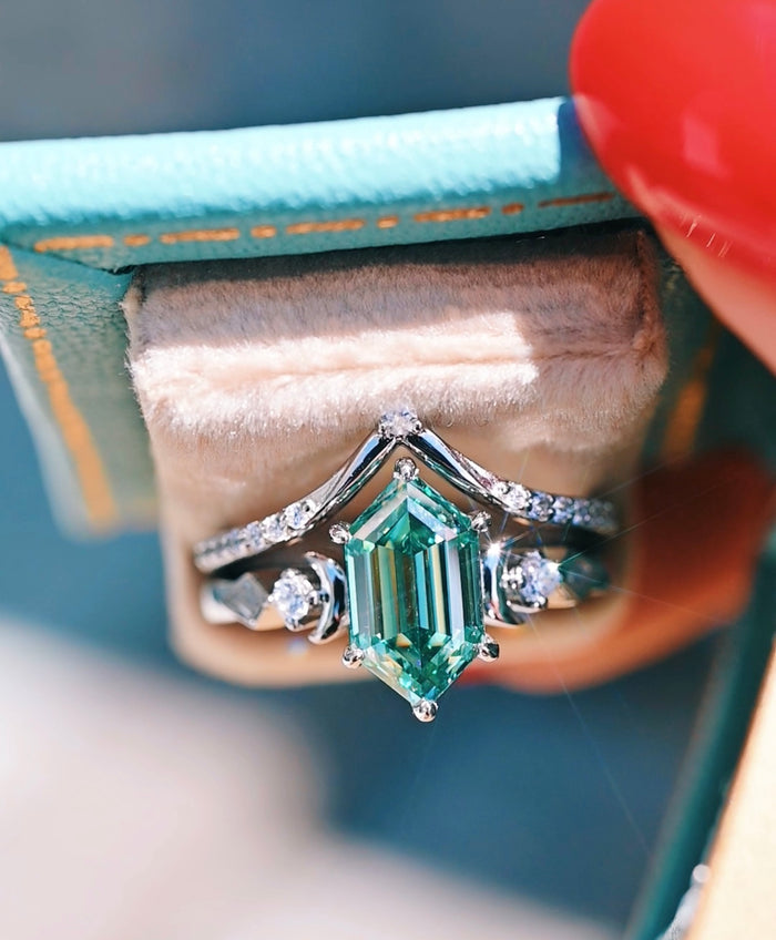 Elara Pacific Green Moissanite & Crescent Moon Engagement Ring Set in 14K White Gold by Aquamarise Gold showcases a radiant hexagonal green moissanite center with crescent moon and diamond accents, blending celestial elegance with nature-inspired design.