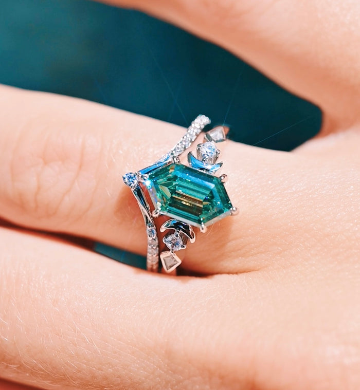 Elara Pacific Green Moissanite & Crescent Moon Engagement Ring Set in 14K White Gold by Aquamarise Gold features a unique hexagonal green moissanite center surrounded by crescent moon and diamond accents, blending celestial and nature-inspired elegance.