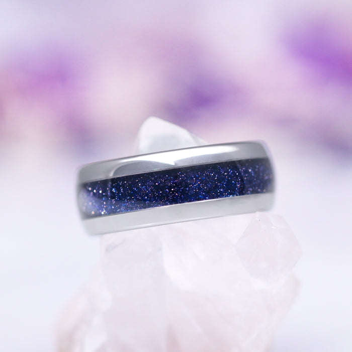 Elara Starry Night and Crescent Moon Couples Ring Set by Aquamarise featuring a polished silver band with a deep blue sandstone inlay that sparkles with a celestial shimmer, part of Matching Couples' Rings and Starry Night™ collections.