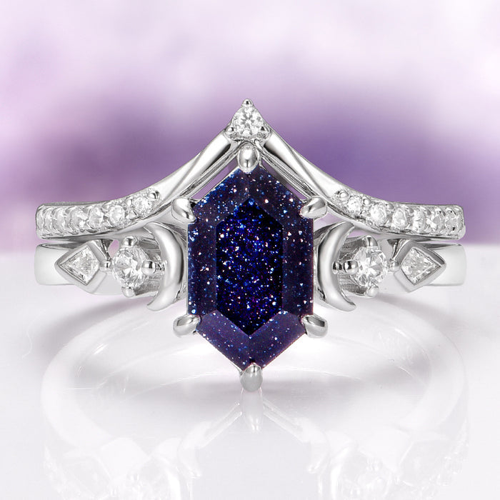 Elara Starry Night and Crescent Moon Couples Ring Set features a hexagonal deep blue sparkling gemstone set in polished sterling silver with rhodium finish, accented by delicate crescent moon and star motifs, designed by Aquamarise for Matching Couples' Rings and Fantasy-Inspired Jewelry collections.