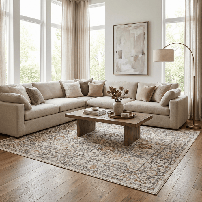 Herstmonceux elegant area rug set in a stylish living room with a sectional sofa and coffee table.