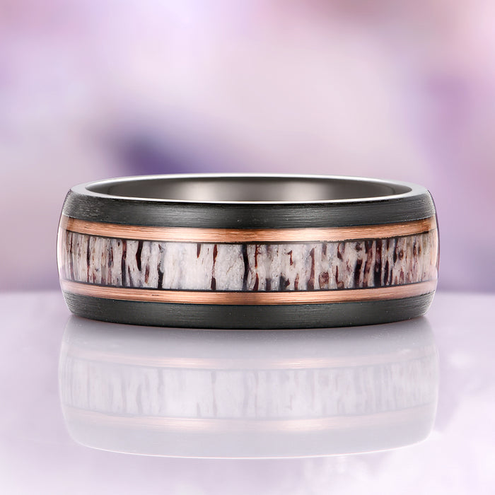 Elk Antler Two-Tone Tungsten Carbide Wedding Band (8mm) by Aquamarise, featuring a textured genuine elk antler inlay bordered by thin rose-gold lines set in a sleek black tungsten carbide band, part of Men’s Wedding Bands and Inlay Wedding Bands collections.