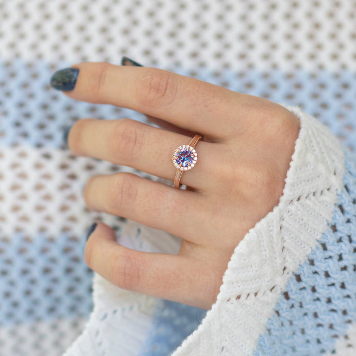 Ella Alexandrite Engagement Ring in 14K Solid Rose Gold by Aquamarise Gold features a round alexandrite center stone encircled by a delicate halo of diamonds on a finely crafted rose gold band, part of the Solid Gold Engagement Rings and June Birthstone Jewelry collections.