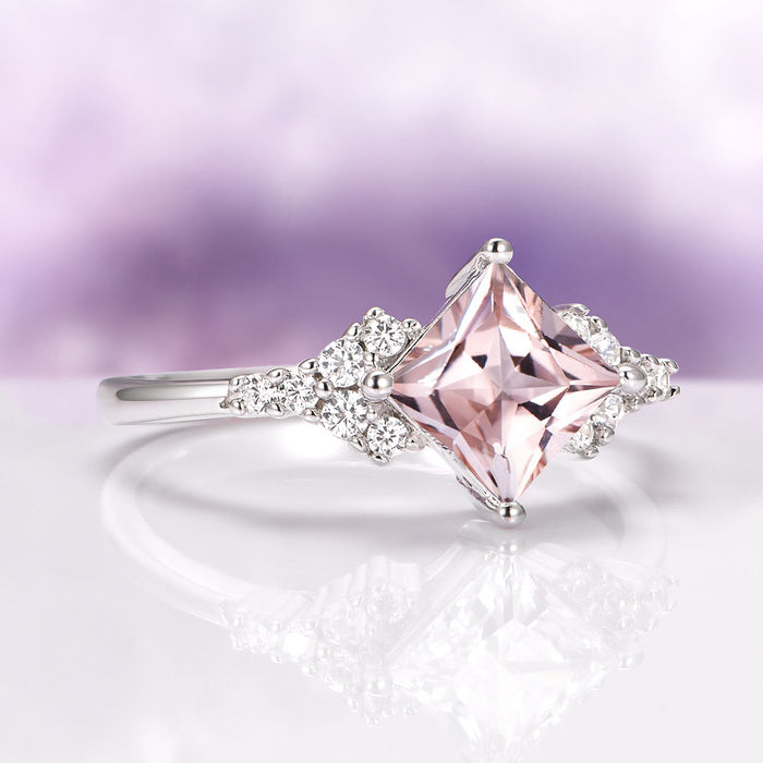 Ellie Princess Cut Morganite Engagement Ring in Sterling Silver by Aquamarise featuring a blush pink princess-cut morganite with sparkling simulated diamond accents on a delicate band.