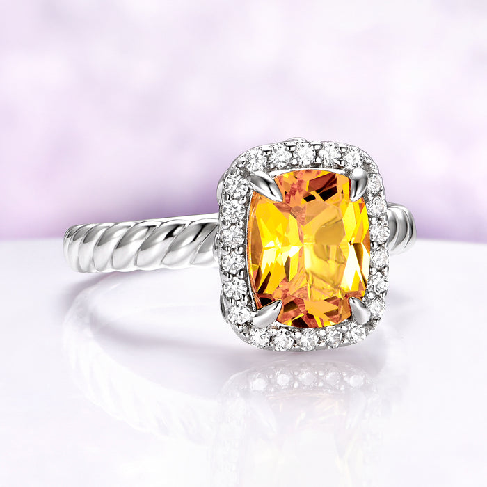 Lemon yellow sapphire engagement ring with cushion cut lab grown sapphire and halo accents in sterling silver vintage design.