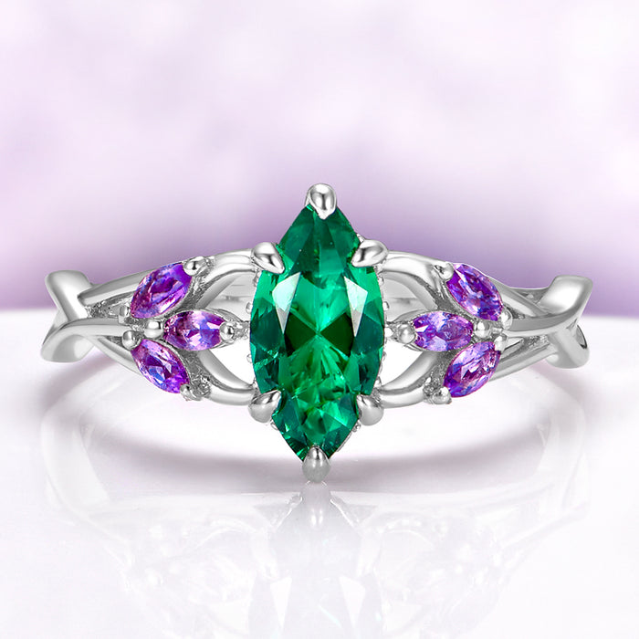 Emerald & Amethyst Mystical Fairy Ring in 14K White Gold by Aquamarise Gold, featuring a marquise emerald center with amethyst accents in an intricate fantasy-inspired design.