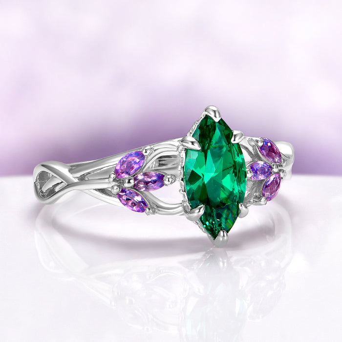 Emerald & Amethyst Mystical Fairy Ring in 14K White Gold featuring a marquise emerald center with delicate amethyst accents in a fantasy-inspired design by Aquamarise Gold.