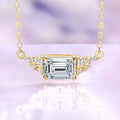 Emerald cut moissanite necklace in 14K yellow gold vermeil, 6x8mm center stone set east-west with round moissanite accents