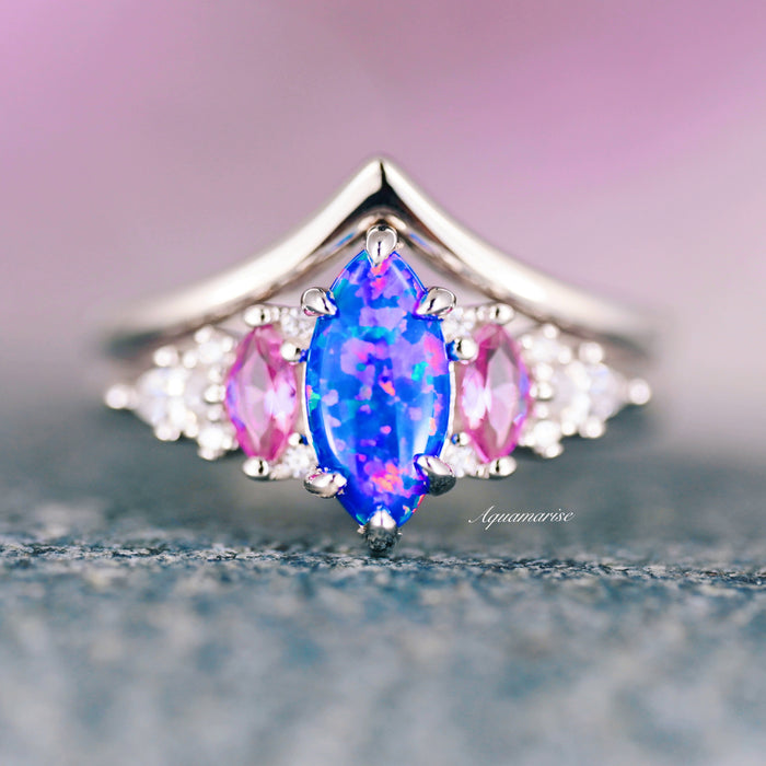 Emerie Blue Fire Opal & Pink Sapphire Ring Set in Sterling Silver featuring a vibrant marquise blue fire opal center with pink sapphire accents and delicate white stones, crafted by Aquamarise from nature-inspired collections.
