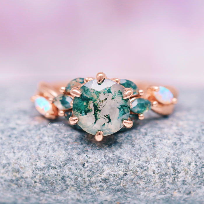 Enchanted Garden Green Moss Agate & Fire Opal Ring- 14K Solid Rose Gold featuring a marquise green moss agate center stone accented by fire opals and smaller green sapphires, crafted by Aquamarise Gold for nature-inspired and fantasy engagement collections.