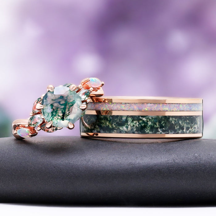 Enchanted Garden moss agate and fire opal couples ring set side by side, rose gold engagement ring beside the men's opal and moss agate inlay band