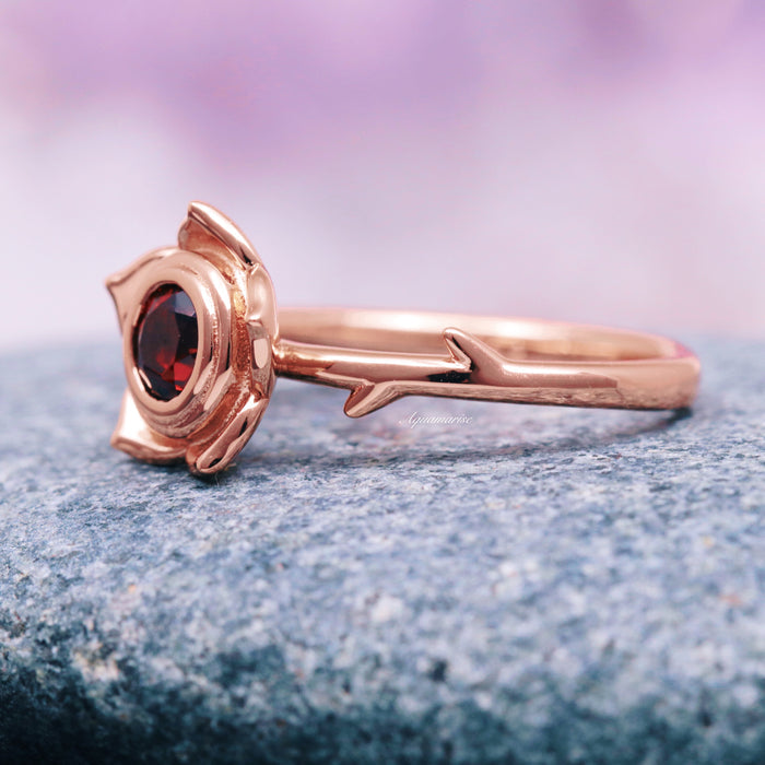 Enchanted Rose Red Garnet Ring- 14K Rose Gold Vermeil by Aquamarise, showcasing a deep red garnet set in a rose-inspired bezel with a delicate band reminiscent of a rose stem, part of Rose Gold Vermeil Rings and January Birthstone Jewelry collections.