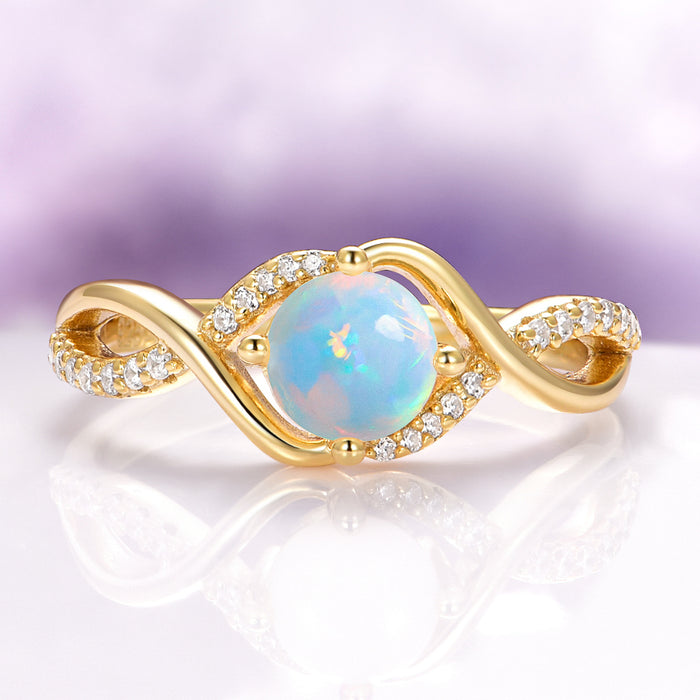 Entwined Natural Australian Opal Engagement Ring in 14K Solid Yellow Gold by Aquamarise Gold, featuring a luminous opal center with intertwined diamond-accented yellow gold band.