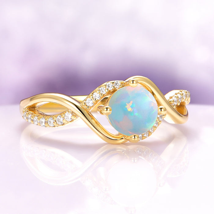 Entwined Natural Australian Opal Engagement Ring in 14K Solid Yellow Gold by Aquamarise Gold, featuring a glowing opal and diamond-accented intertwined band on reflective surface.