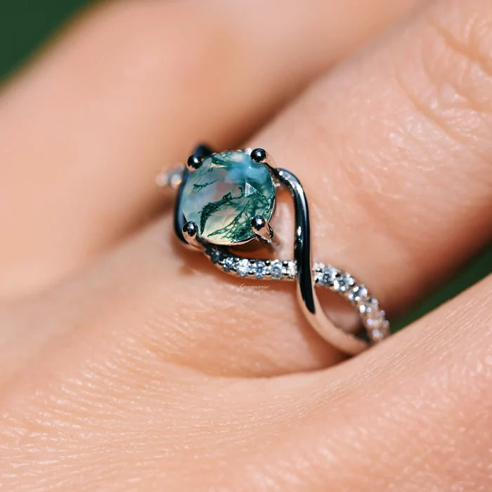 Entwined Green Moss Agate Ring- Sterling Silver by Aquamarise, featuring a natural green moss agate and sparkling pavé stones on a twisted sterling silver band.
