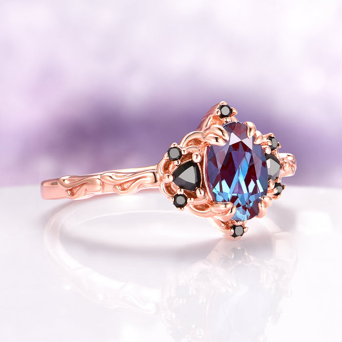 Esme Alexandrite & Black Onyx Engagement Ring in 14K Rose Gold Vermeil by Aquamarise featuring a marquise-cut color-changing alexandrite center stone, black onyx accents, and an intricately carved rose gold vermeil band from Rose Gold Vermeil Rings and June Birthstone Jewelry collections.