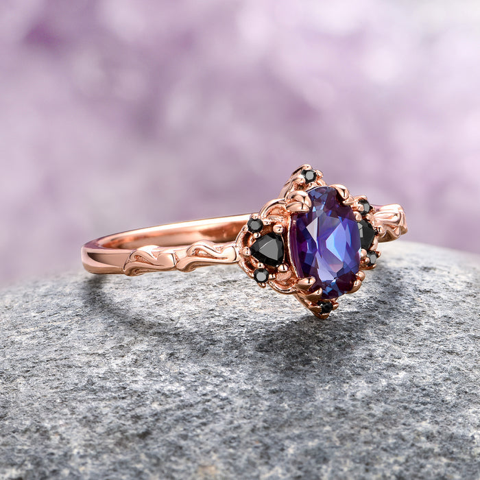 Esme Alexandrite & Black Onyx Engagement Ring in 14K Rose Gold Vermeil by Aquamarise featuring a deep purple oval alexandrite centerpiece accented with black onyx stones on an intricately carved rose gold vermeil band, part of Rose Gold Vermeil Rings and June Birthstone Jewelry collections.