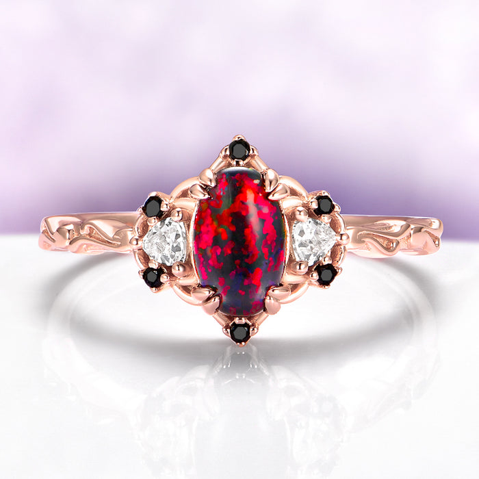 Esme Black Fire Opal & Onyx Ring in 14K Rose Gold Vermeil by Aquamarise, featuring a fiery opal center with black onyx and diamond accents in a fantasy-inspired rose gold design.