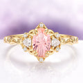 Esme Fireworks Cut Morganite Engagement Ring in 14K Solid Yellow Gold by Aquamarise Gold, featuring a dazzling star-cut oval morganite center stone accented with pear-shaped diamonds and intricate vintage-inspired gold detailing, part of Solid Gold Engagement Rings and Morganite Jewelry collections.